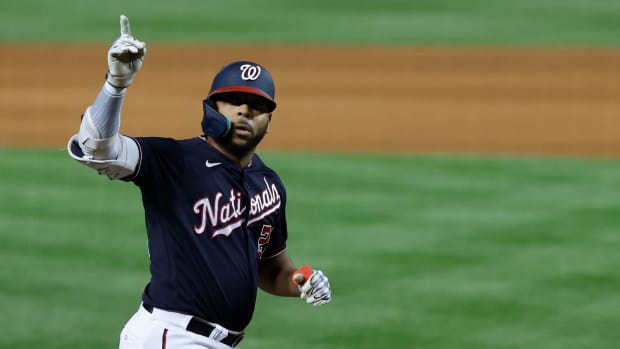 Sep 18, 2023; Washington, District of Columbia, USA; Washington Nationals first baseman Dominic Smith (22) gestures to the stands while crossing home plate after hitting a home run against the Chicago White Sox during the ninth inning at Nationals Park. Mandatory Credit: Geoff Burke-USA TODAY Sports